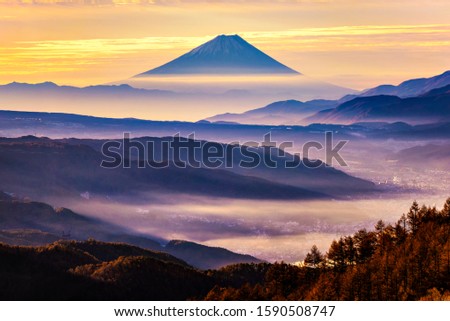 Fuji Mountain with Morning Mist at Takabocchi HIghlands in Autumn, Nagano, Japan