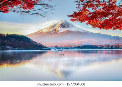 Fuji Mountain Reflection and Red Maple Leaves with Morning Mist in Autumn, Kawaguchiko Lake, Japan - Powered by Shutterstock