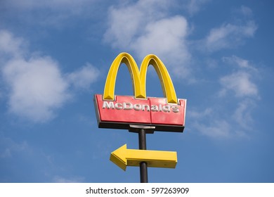 FUJIAN, CHINA - June 29:  McDonalds logo on blue sky background on June. 29, 2012 in Fujian, China.  McDonald's Corporation is the world's largest chain of hamburger fast food restaurants. 