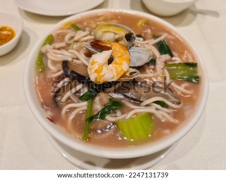 Fujian Red Mushroom Seafood Lor Mee Noodles. Selective focus.