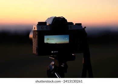 Fujifilm Camera in front of sunset background