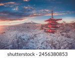 Fujiyoshida, Japan Beautiful view of mountain Fuji and Chureito pagoda at sunrise of Mount Fuji during winter.This is one of the famous spot to take pictures of Mount Fuji.