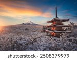 Fujiyoshida, Japan Beautiful view of mountain Fuji and Chureito pagoda at sunrise of Mount Fuji during winter.This is one of the famous spot to take pictures of Mount Fuji.