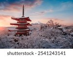 Fujiyoshida, Japan Beautiful view of mountain Fuji and Chureito pagoda at sunrise of Mount Fuji during winter.This is one of the famous spot to take pictures of Mount Fuji.