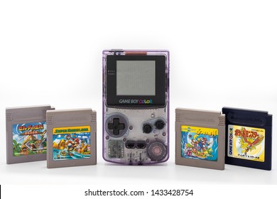 Fukuoka, Japan - June 23, 2019 : The Famous Nintendo Game Boy Color Portable Console With Some Famous Game Cartridges 