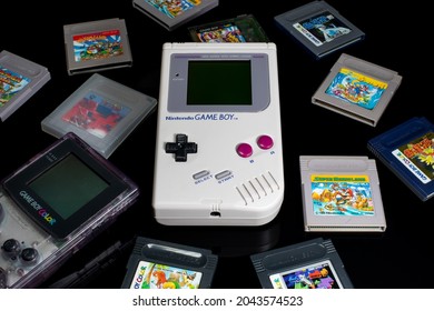 Fukuoka, Japan - September 19, 2021 : Nintendo Game Boy And Game Boy Color With Various Game Cartridges Isolated On Black Background 