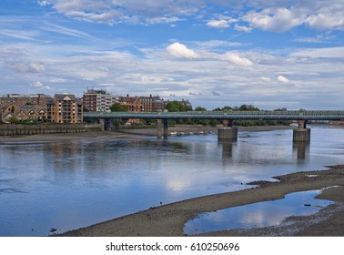 Fulham Railway Bridge And Residential Buildings Seen Across Thames In London, England