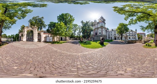 full 360 panorama on near catholic gothic church with gate in old town with historical buildings, temples and town hall in equirectangular projection - Shutterstock ID 2195259675