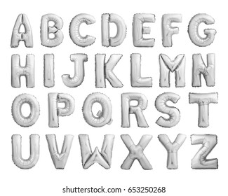 Full alphabet of silver metallic inflatable balloons isolated on white background
