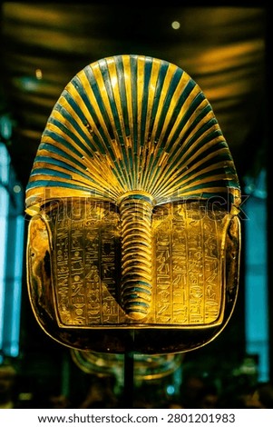Full Back View of King Tutankhamun Golden Mask Exhibit with Hieroglyphic Text in the Grand Egyptian Museum