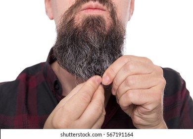 full bearded man using beard balm or oil, care product for men, isolated on white