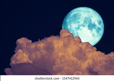 Full Beaver Moon back dark orange cloud on night sky, Elements of this image furnished by NASA