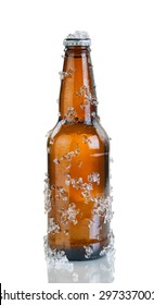 Full beer bottle covered with ice and condensation. Layout in vertical format isolated on white background with reflection.  