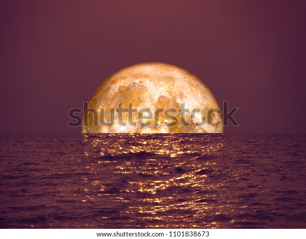 full\
blood moon light orange on sea and reflection moon light on\
surface, Elements of this image furnished by\
NASA