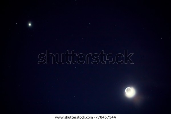 Full\
blue moon with star at dark night sky\
background