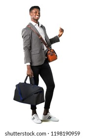 Full Body Of African American Business Man Traveling With Suitcases Pointing Back With The Index Finger Presenting A Product On White Background