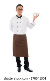 Full Body Asian Chef Holding An Empty Plate Ready For Food, Standing Isolated On White Background.