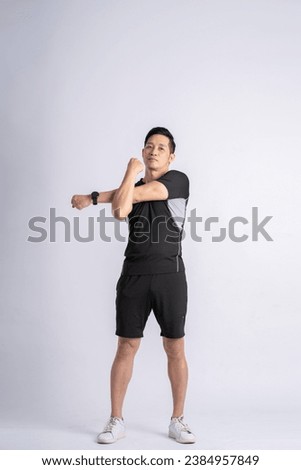 Full body Asian man wearing sportswear posing on white background