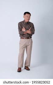 Full Body Of An Asian Old Man Standing In Studio White Background. Isolated Asian Elderly Man In Studio.