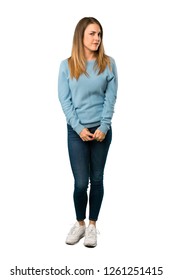 Full Body Of Blonde Woman With Blue Shirt Feeling Upset On White Background