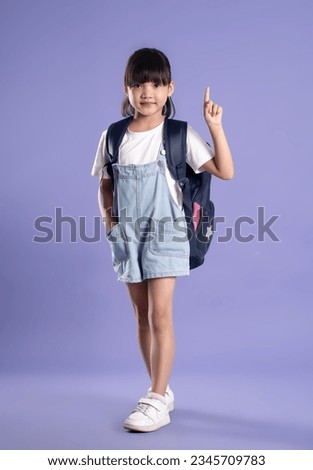 full body cute asian girl posing on purple background