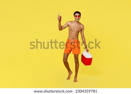 Image, Stock Photo Black man in swimsuit sitting on sandy beach