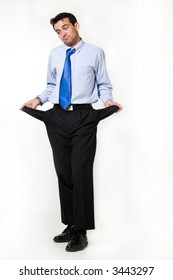 Full Body Of A Handsome Brunette Young Business Man Standing On White Holding Out Empty Pant Pockets