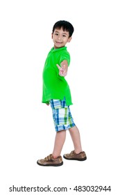 Full Body Of Happy Asian Child In Leather Shoes Smiling And Looking At Camera. Stylish Boy Having Fun And Standing At Studio. Isolated On White Background. Studio Shot. Positive Human Emotion.