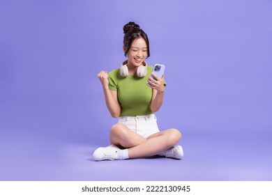 full body image of beautiful asian girl posing on pink background - Powered by Shutterstock