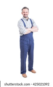 Full body of joyful mechanic standing  with spanner in his hands showing a friendly attitude isolated on white background