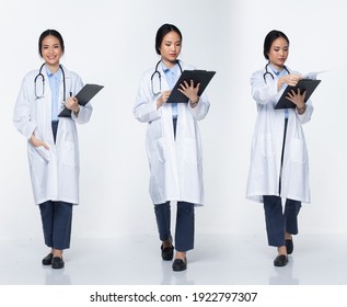 Full body length Figure snap of 20s Asian Woman wear Doctor White uniform pants, stethoscope and walk with paper chart, white Background isolated - Powered by Shutterstock