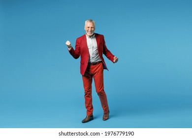 Full Body Length Of Happy Joyful Elderly Gray-haired Mustache Bearded Business Man Wearing Red Jacket Suit Doing Winner Gesture Clenching Fists Isolated On Blue Color Wall Background Studio Portrait