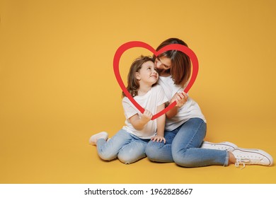 Full Body Length Happy Woman In Basic White T-shirt Have Fun Sit On Floor Child Baby Girl 5-6 Years Old Mom Mum Little Kid Daughter Isolated On Yellow Color Background Studio Mother's Day Love Family