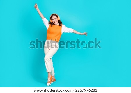 Full body length photo of careless office business manager woman wear uniform listen music lightness isolated on aquamarine color background