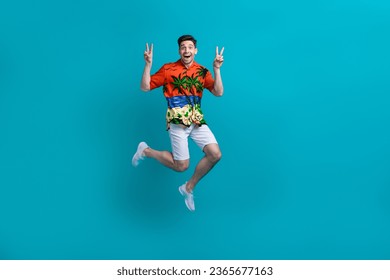 Full body length photo of good mood crazy guy brunet hair show double v sign fingers beach party positive isolated on blue color background