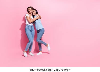 Full body length photo of positive cuddles optimistic have fun trust each other young girls family isolated on pastel pink color background - Powered by Shutterstock