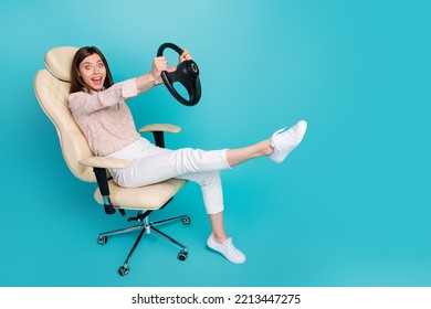 Full Body Length Size Photo Of Excited Funky Rider Auto New Owner Sitting Boss Office Chair Playing Simulator Steering Wheel Crazy Isolated On Blue Color Background