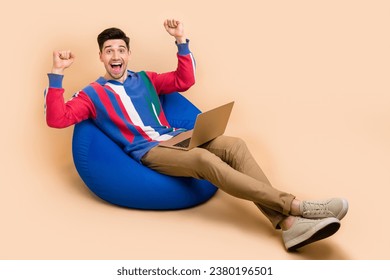 Full body length size photo of crazy stocks market trader young guy celebrate his deal successfully done isolated on beige color background