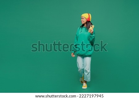 Similar – Image, Stock Photo Preteen girl in hoodie standing near green trees