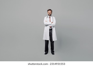 Full body male doctor fun man wears white medical gown suit work in hospital hold hands crossed folded look camera isolated on plain grey color background studio portrait. Healthcare medicine concept - Shutterstock ID 2314931553