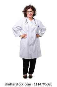 Full Body Middle Age Doctor Woman With Hands On Hips, Standing, Relaxed And Smiling, Very Positive And Cheerful