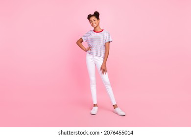 Full body photo of african american girl good mood casual clothes hand waist smile isolated on pink color background - Powered by Shutterstock