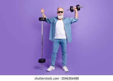 Full body photo of aged man sporty happy positive smile training arms muscles barbell isolated over purple color background - Shutterstock ID 2046306488