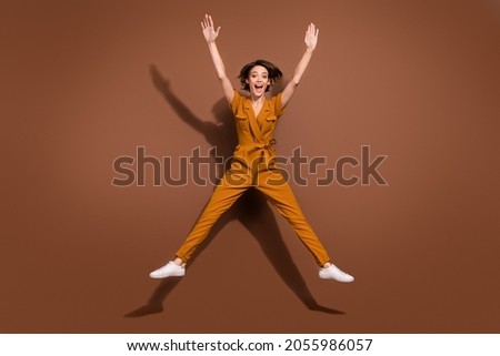 Similar – Image, Stock Photo Stylish woman with raised arm leaning on wall on street