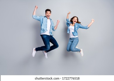 Full body photo of attractive lady handsome funny guy crazy fan jumping high up celebrating football team winning wear casual denim shirts outfit isolated grey color background - Shutterstock ID 1722776518