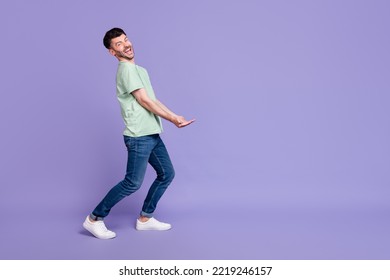 Full body photo of attractive man carry empty space invisible heavy box dressed stylish gray garment isolated on purple color background - Shutterstock ID 2219246157