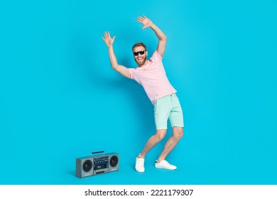 Full Body Photo Of Attractive Young Guy Dancing Bachelorette Discotheque Dressed Stylish Pink Look Isolated On Aquamarine Color Background