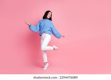 Full body photo of carefree stunning lady enjoy dancing partying empty space isolated on pink color background - Shutterstock ID 2294476089