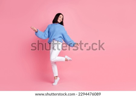 Full body photo of carefree stunning lady enjoy dancing partying empty space isolated on pink color background