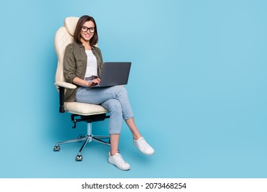 Full Body Photo Of Ceo Lady Sit Chair Use Device Texting Typing Message Wear Khaki Denim Outfit Isolated Over Blue Color Background